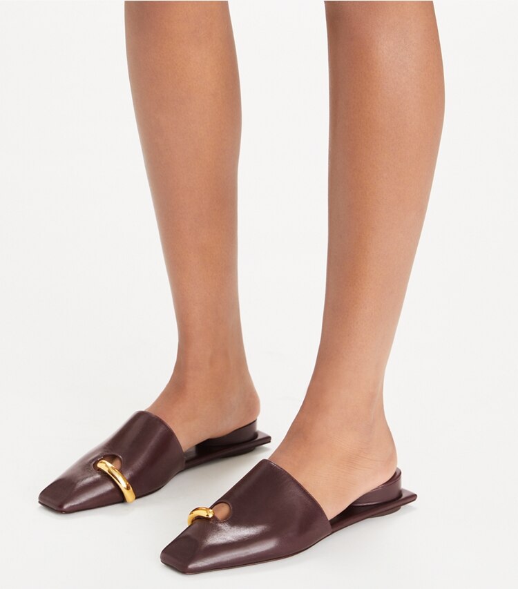 Tory Burch designer flats Pierced Mule in PLUM / GOLD accessory on model