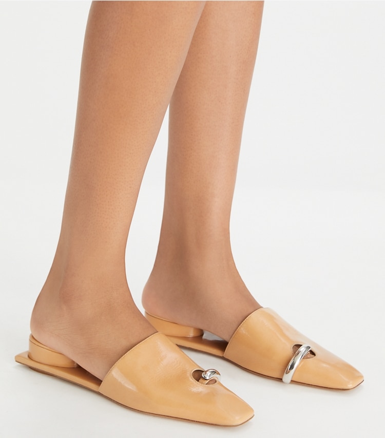 Tory Burch designer flats Pierced Mule in CANTUCCI / SILVER accessory on model