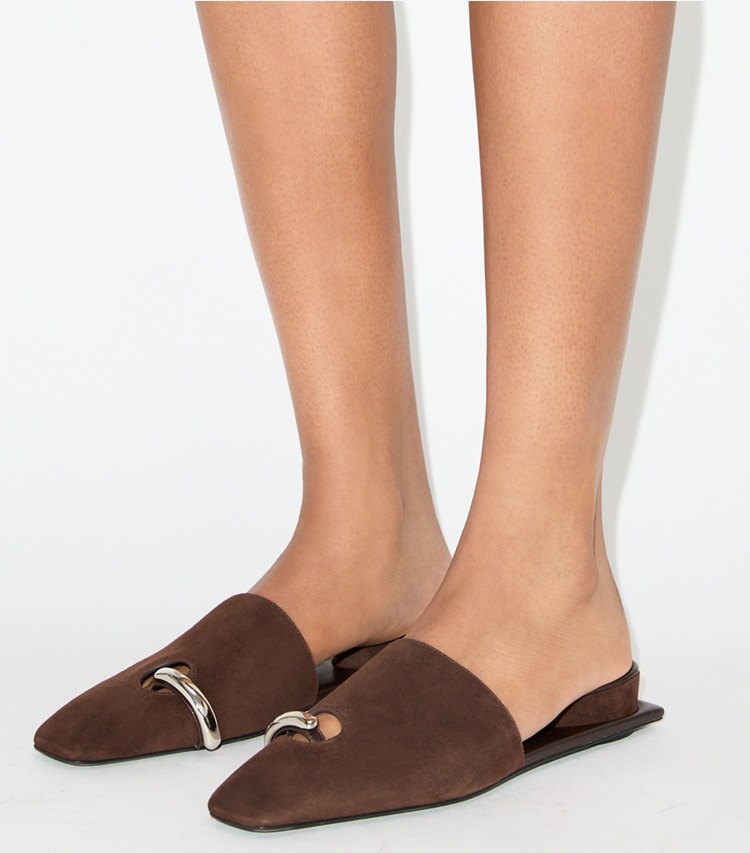 Tory Burch designer flats Pierced Mule in DARK COCOA / SILVER accessory on model