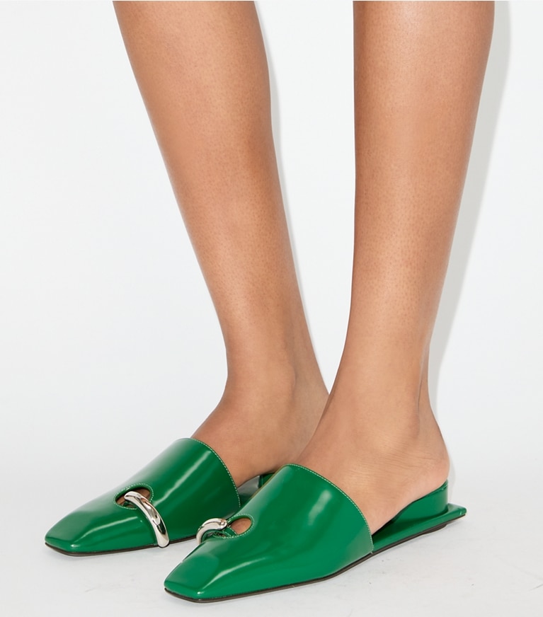 Tory Burch designer flats Pierced Mule in GRASS / SILVER accessory on model