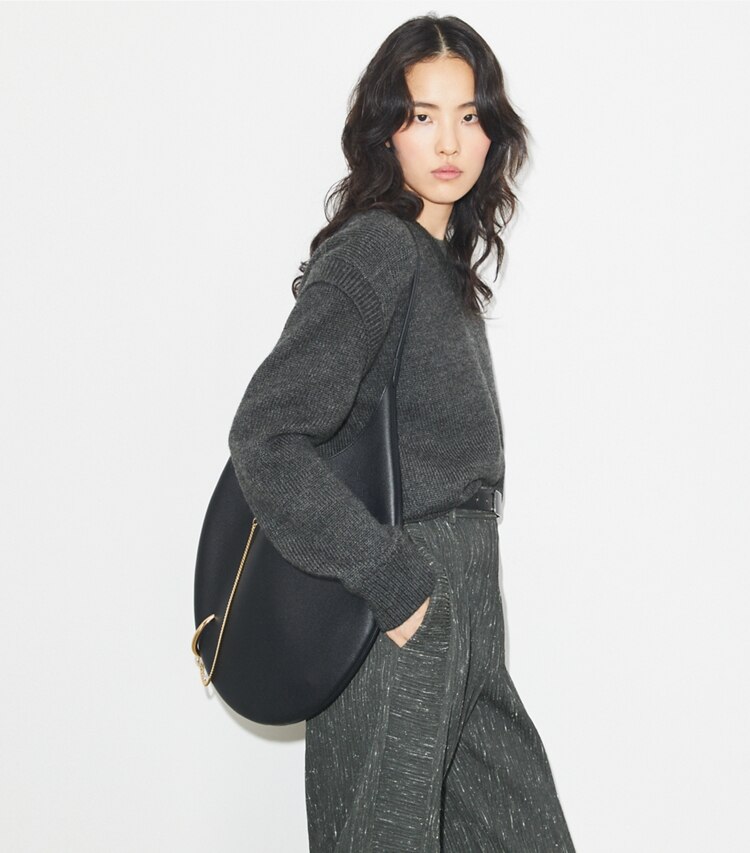 Tory Burch designer shoulder bags Pierced Soft Bag in BLACK/GOLD accessory on model