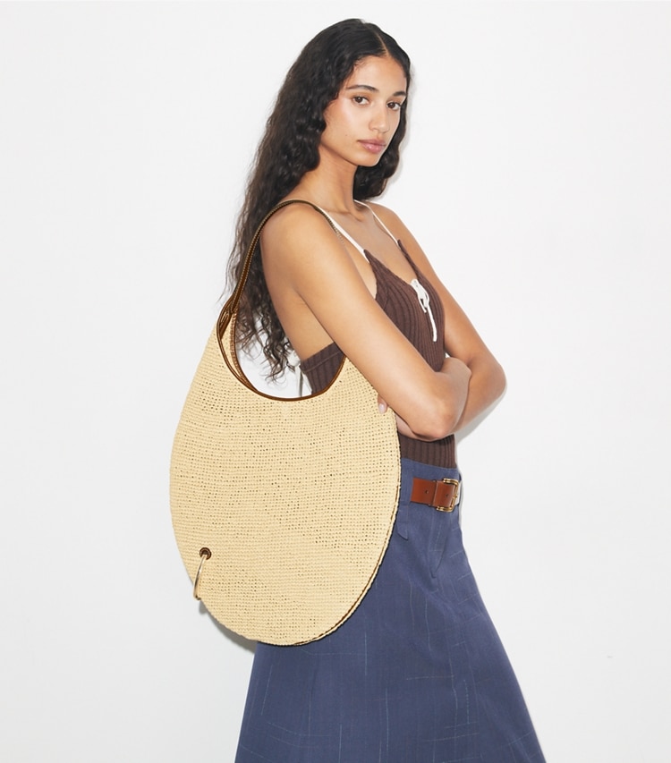Tory Burch designer shoulder bags Pierced Soft Straw Bag in Natural accessory on model