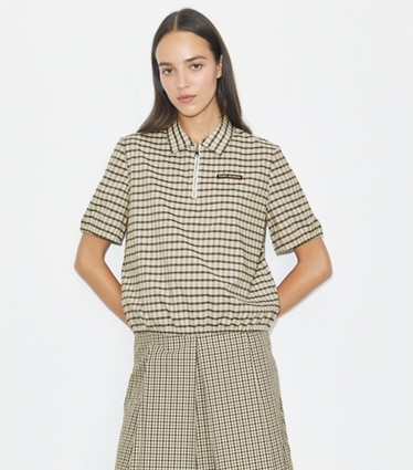 Tory Burch designer トップス プレイド ハーフジップ ポロシャツ in Ivory / Black Plaid on model detail