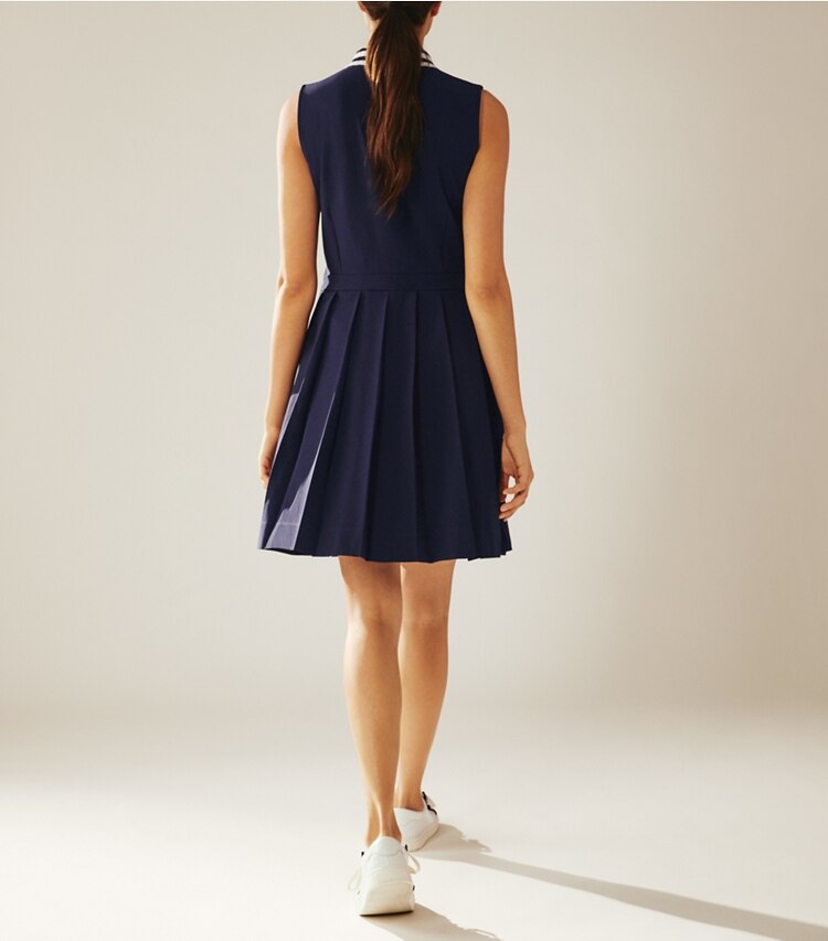 Tory Sport designer dresses Pleated Golf Dress in Tory Navy on model back