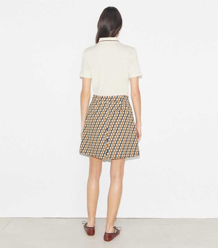 Tory Burch designer bottoms Pleated Golf Skirt in Tory Navy Linked Geo Multi-Color on model back