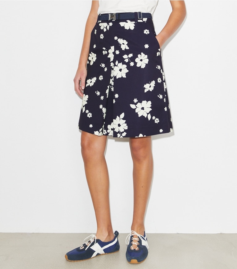 Tory Burch designer bottoms Pleated Golf Skirt in Medium Navy Contrast Floral on model detail
