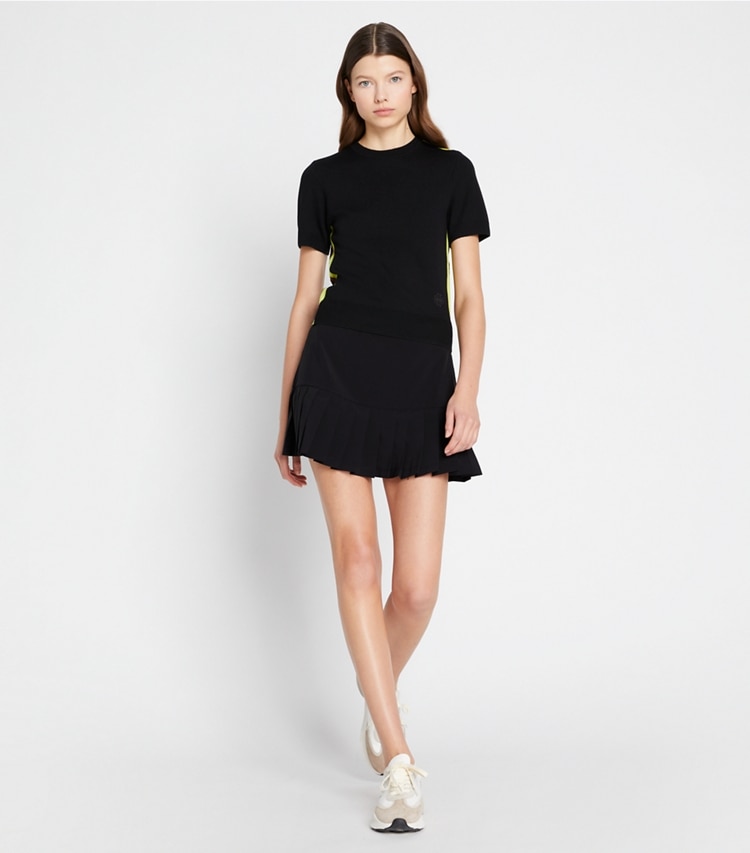Tory Sport designer bottoms Pleated-Hem Tennis Skirt in Black on model front