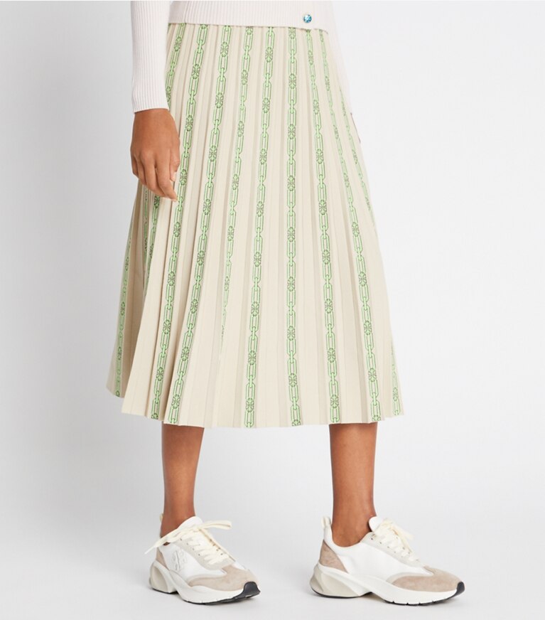 Tory Sport designer bottoms Pleated Jacquard Tech Knit Skirt in Pale Stone Chainlink Logo front