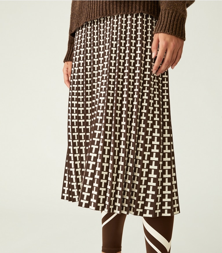 Tory Sport designer bottoms Pleated Jacquard Tech Knit Skirt in Dark Roast Two Way T front