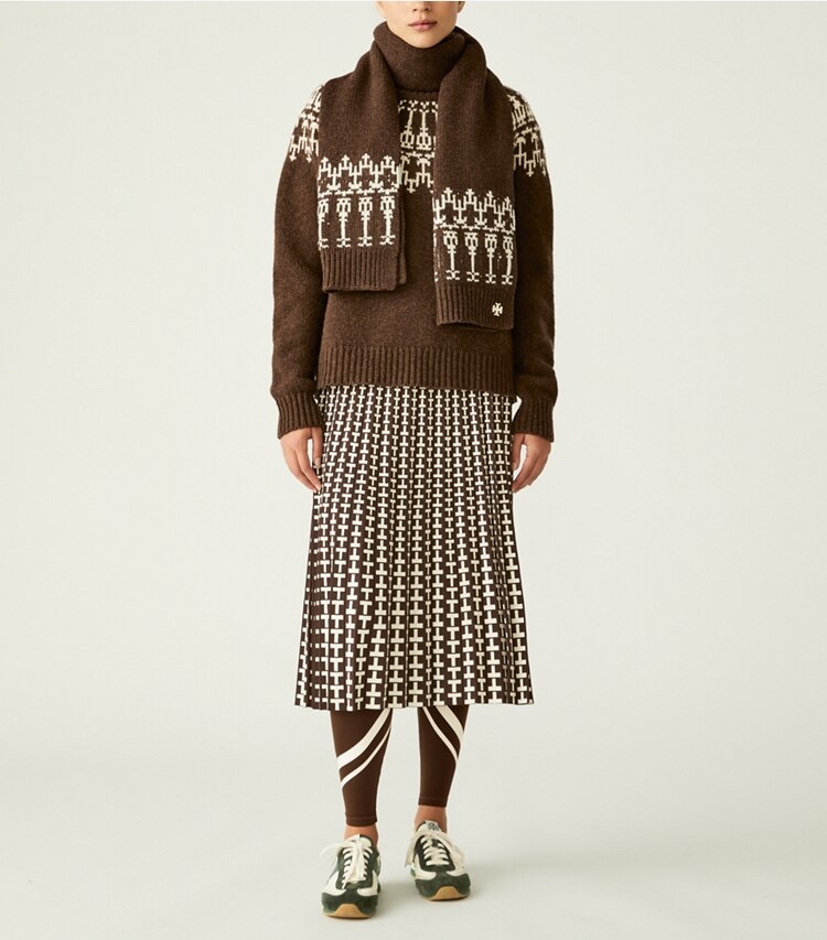 Tory Sport designer bottoms Pleated Jacquard Tech Knit Skirt in Dark Roast Two Way T on model front