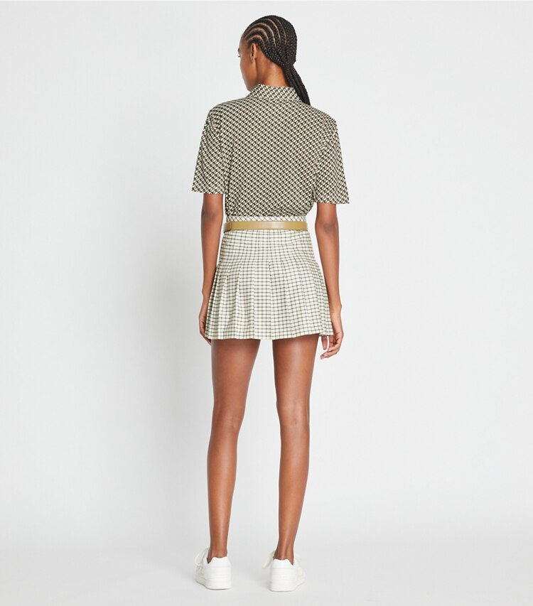 Tory Sport designer bottoms Pleated Printed Tennis Skirt in Sesame Petite Plaid on model back