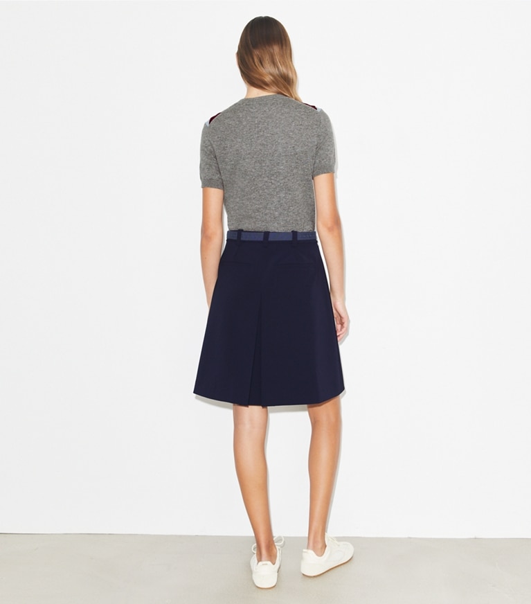 Tory Burch designer bottoms Pleated Stretch Golf Skirt in Deep Navy on model back