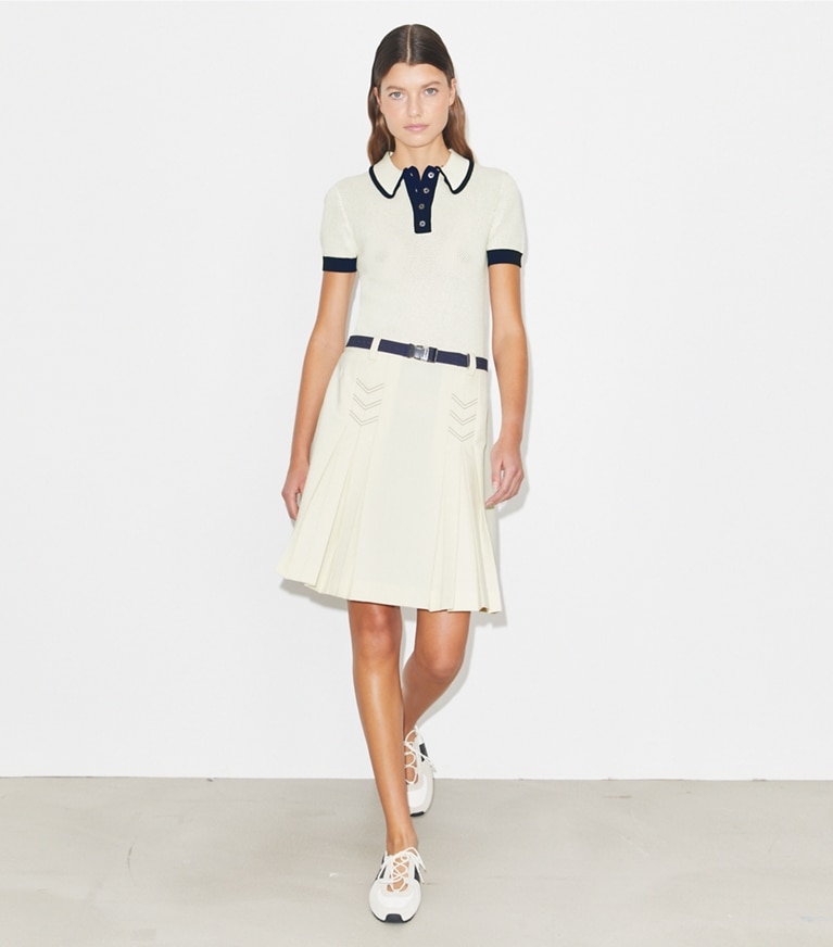 Tory Burch designer bottoms Pleated Stretch Golf Skirt in New Ivory on model front