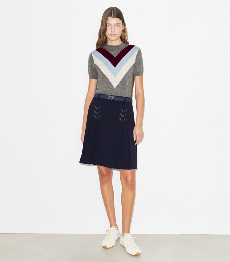 Tory Burch designer bottoms Pleated Stretch Golf Skirt in Deep Navy on model front