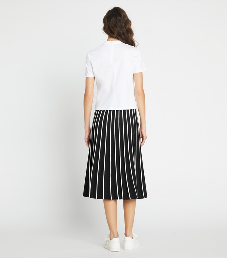 Tory Sport designer bottoms Pleated Tech Knit Skirt in Black / Light Raven on model back