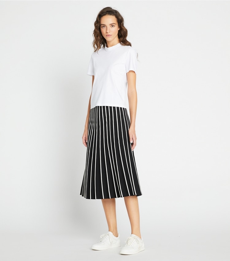 Tory Sport designer bottoms Pleated Tech Knit Skirt in Black / Light Raven on model front
