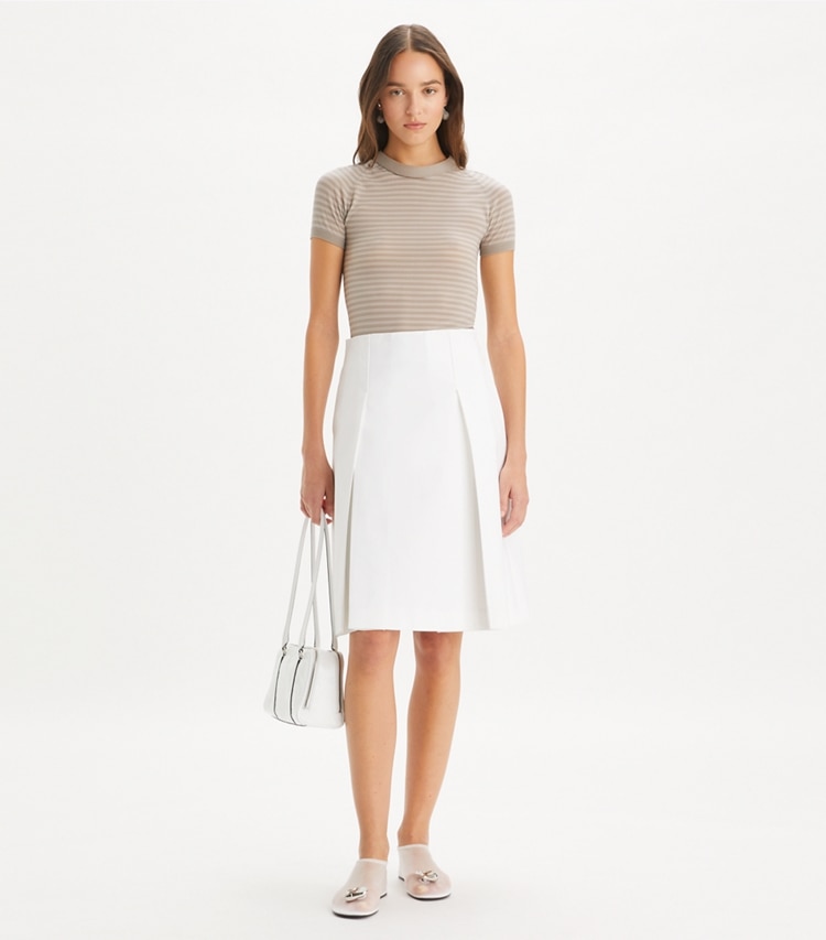 Tory Burch designer bottoms Pleated Twill Skirt in White on model front
