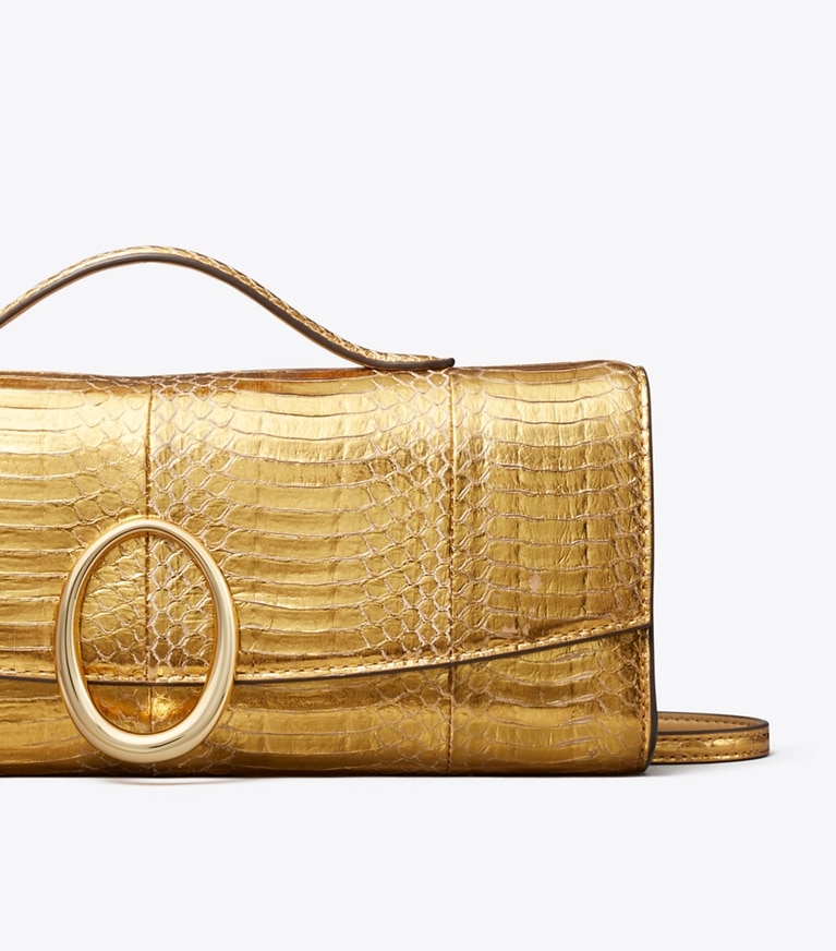 Tory Burch designer pochettes Pochette Pierced en peau de serpent dans Gold détails
