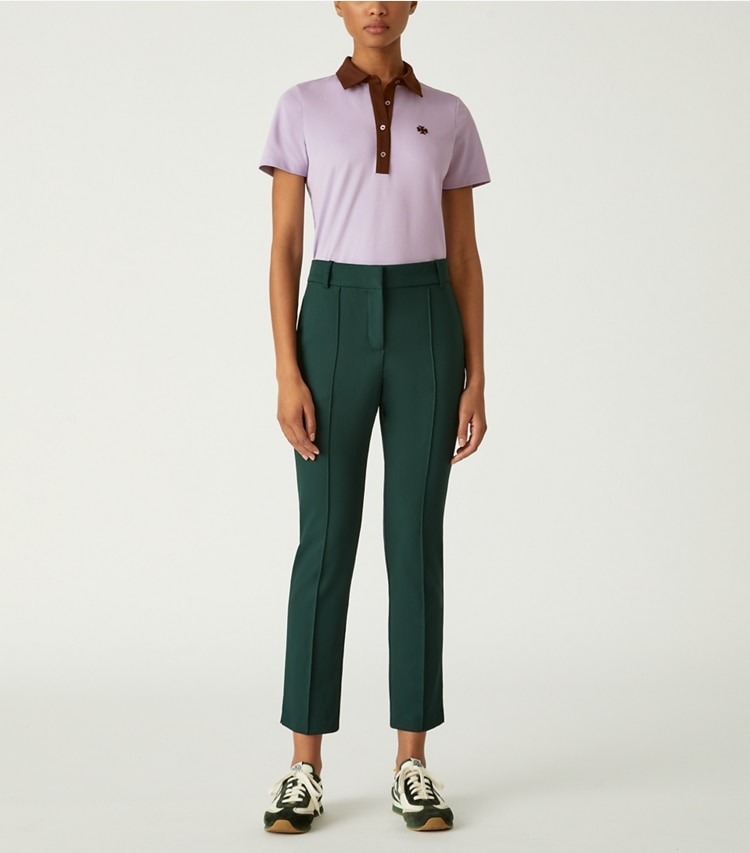Tory Sport designer oberteile Polo aus Funktionspiqué in Colorblock-Optik in Lavender Field / Dark Roast modell von vorn