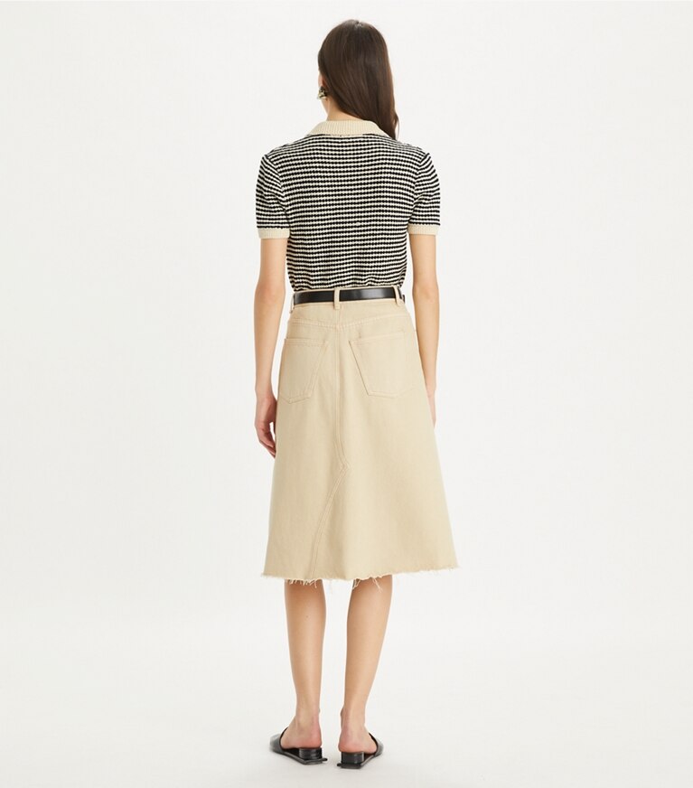 Tory Burch diseñador tops Polo de algodón a rayas con pespuntes en Medium Navy / French Cream en el modelo (espalda)