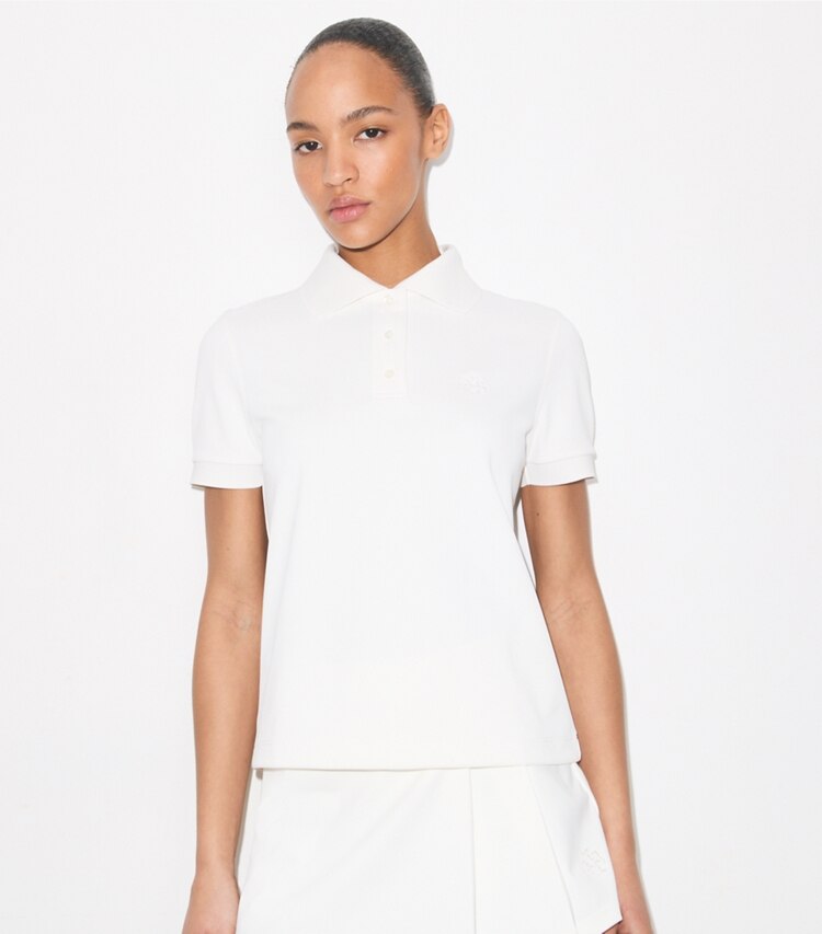 Tory Burch diseñador tops Polo de tenis con logotipo bordado en Snow White detalle en modelo