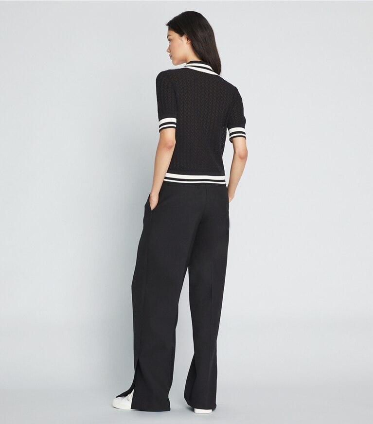 Tory Sport designer sweaters Polo en coton pointelle in Black / New Ivory front