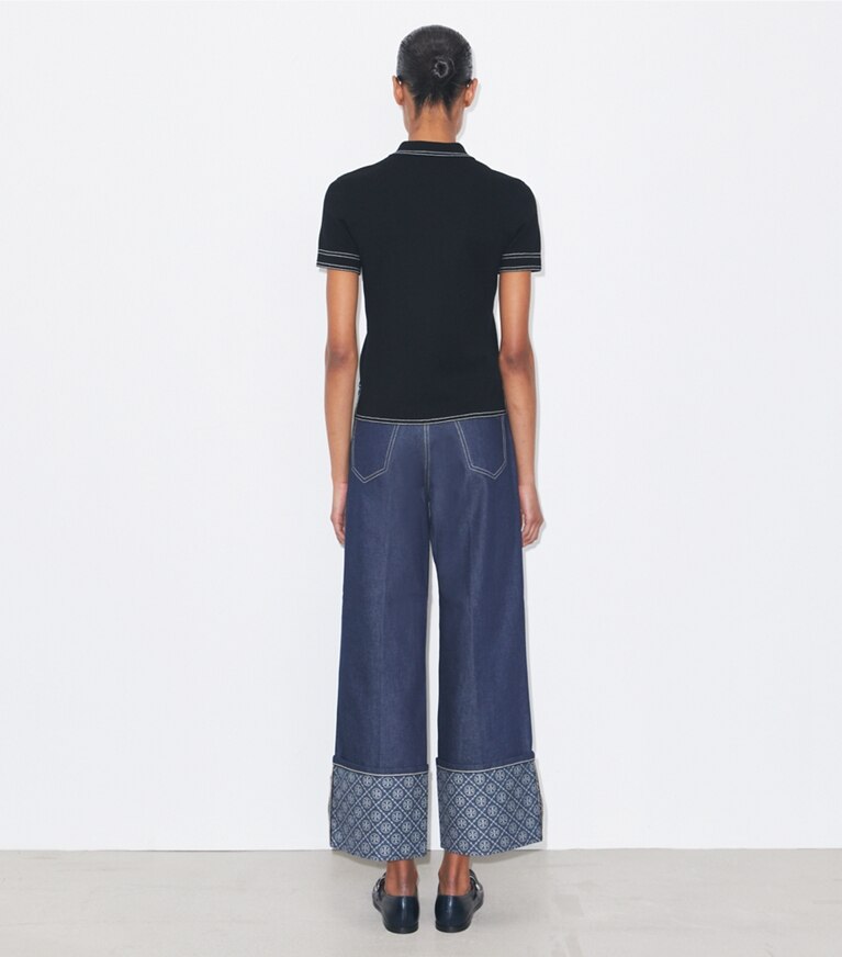 Tory Burch designer sweaters Polo en laine surpiqué dans Black sur modèle, de dos