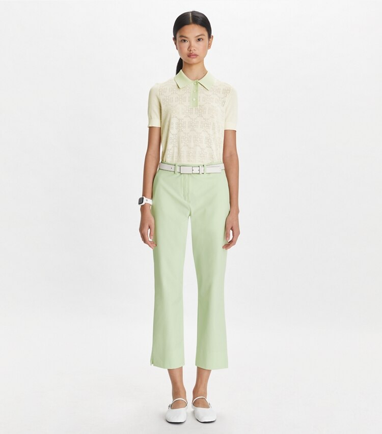 Tory Sport designer maglioni Polo in cotone traforato con logo in NEW IVORY / Light Peppermint parte anteriore su modella