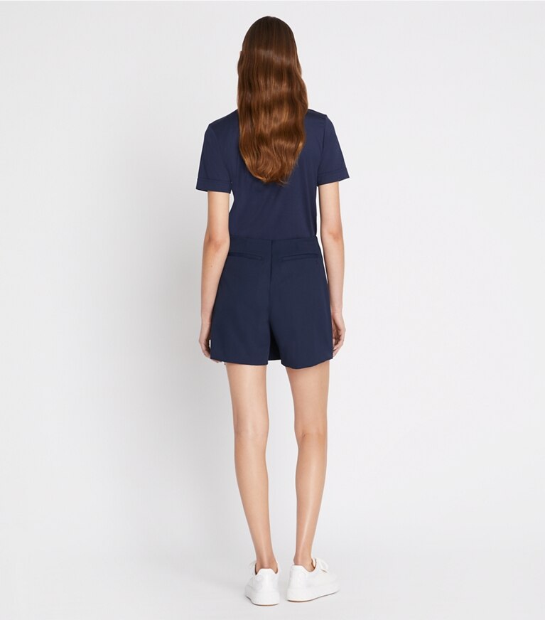 Tory Burch designer hauts Polo rétro en coton mercerisé dans Tory Navy sur modèle, de dos