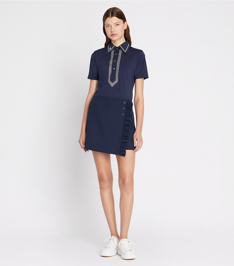 Tory Burch designer hauts Polo rétro en coton mercerisé dans Tory Navy sur modèle, de face