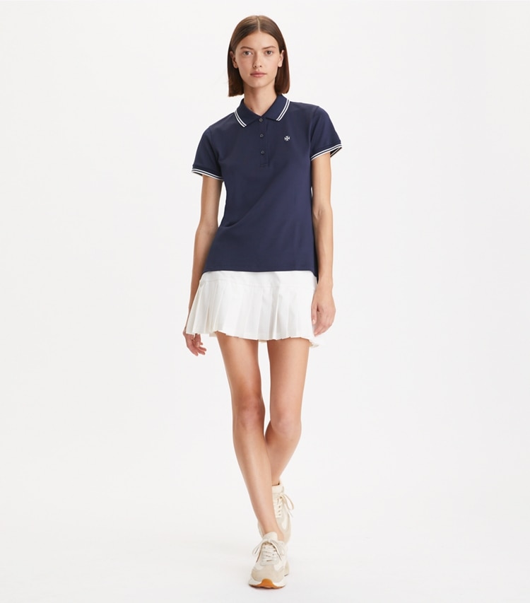 Tory Sport designer hauts Polo Tech Piqué dans Tory Navy sur modèle, de face