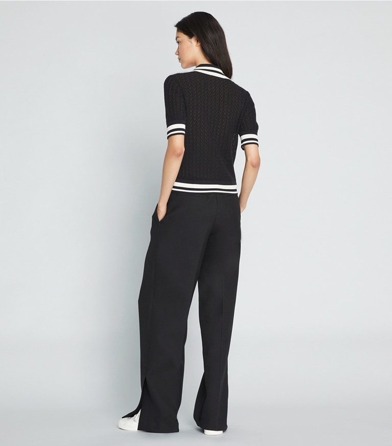 Tory Sport designer strickware Poloshirt aus Baumwolle mit Pointelle-Muster in Black / New Ivory front