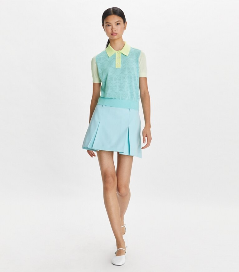 Tory Sport designer strickware Poloshirt aus Baumwolle mit Pointelle-Muster und Logo in Pastel Sky / NEW IVORY front