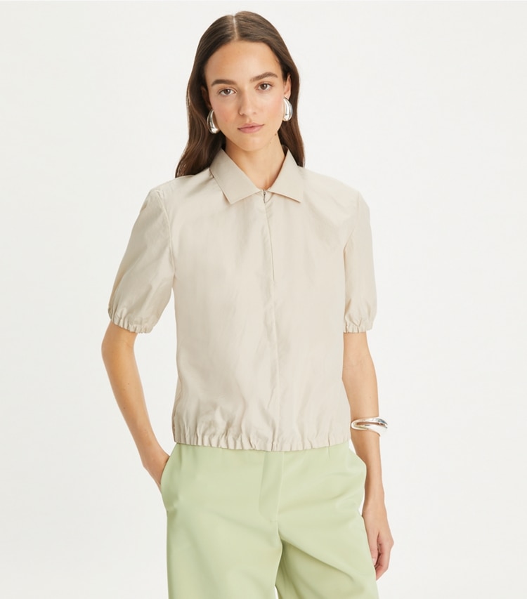 Tory Burch designer tops Poplin Zip Polo in Pale Sandstone on model detail