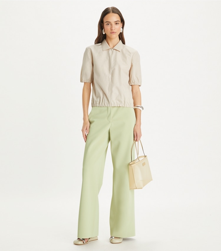 Tory Burch designer tops Poplin Zip Polo in Pale Sandstone on model front