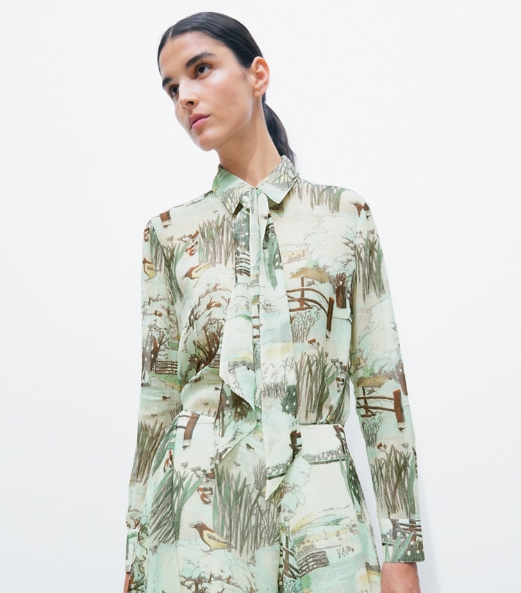 Tory Burch designer tops Printed Chiffon Bow Blouse in Yellow Forest on model detail