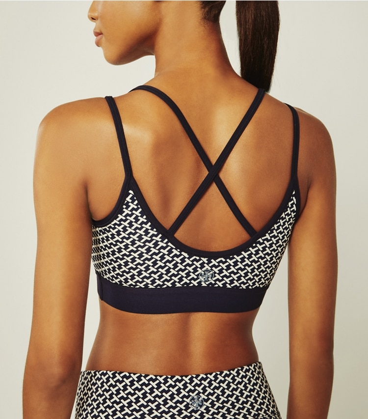 Tory Sport designer sports bras Printed Cross-Back Bra in Tory Navy Diagonal T on model detail