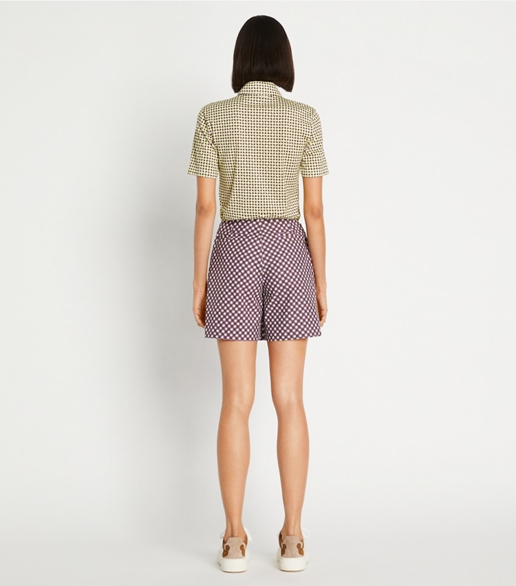 Tory Sport designer bottoms Printed Performance Golf Skort in Mocha Chip Foyer Geo on model back