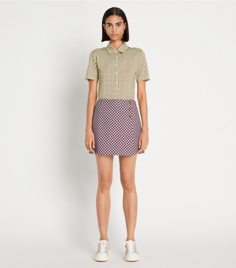 Tory Sport designer bottoms Printed Performance Golf Skort in Mocha Chip Foyer Geo on model front
