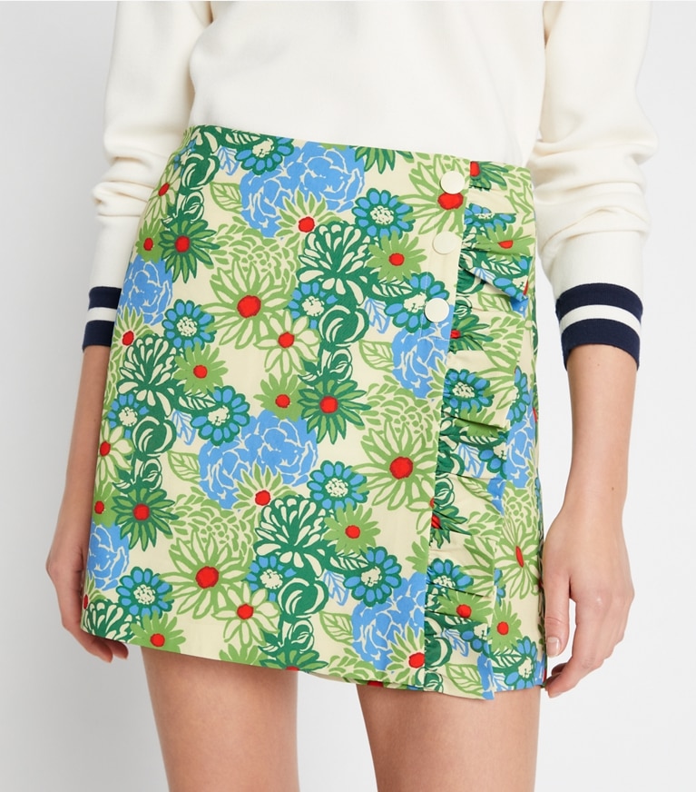 Tory Sport designer bottoms Printed Ruffle Skort in New Ivory Pompon Daisy front