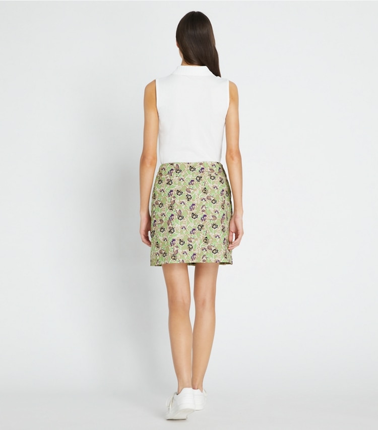 Tory Sport designer bottoms Printed Ruffle Twill Golf Skirt in Green Scribble Floral on model back