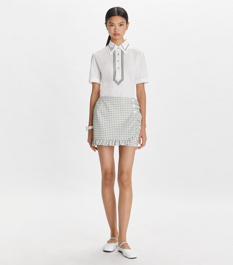 Tory Sport designer bottoms Printed Ruffle Twill Golf Skirt in Grey Gradient Gingham on model front
