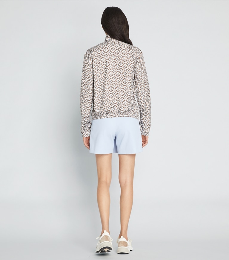 Tory Sport designer jackets Printed Ruffle Windbreaker in Prisimatic T Monogram in Slate Melange front