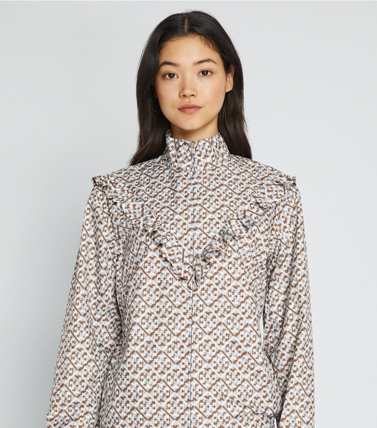 Tory Sport designer jackets Printed Ruffle Windbreaker in Prisimatic T Monogram in Slate Melange on model detail