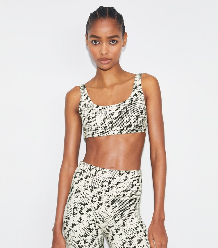 Tory Sport designer sports bras Printed Scoop-Back Bra in New Ivory Distressed Pixelated Logo on model detail