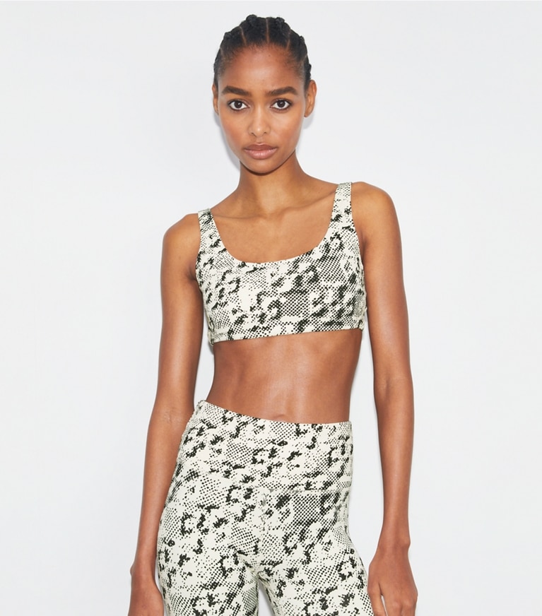 Tory Sport designer sports bras Printed Scoop-Back Bra in New Ivory Distressed Pixelated Logo front