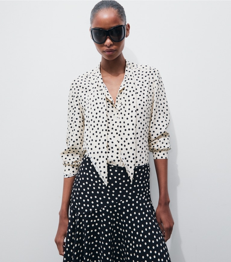 Tory Burch designer tops Printed Silk Bow Blouse in Cream Dot on model detail
