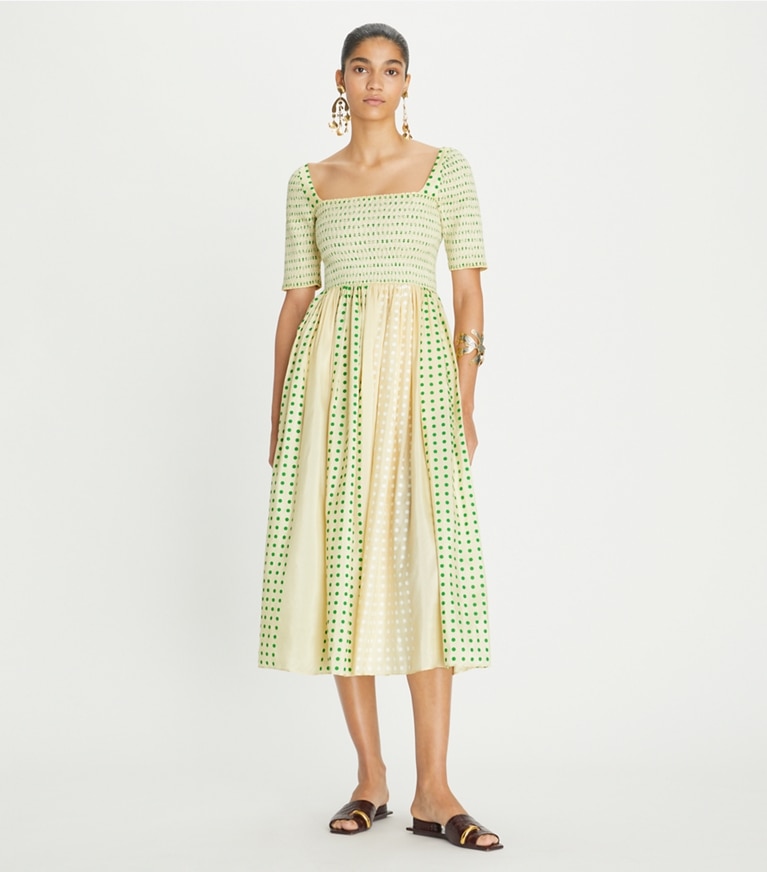 https://s7.toryburch.com/is/image/ToryBurch/style/printed-silk-smocked-dress-on-model-front.TB_150662_290_20230531_OMFRO.pdp-767x872.jpg