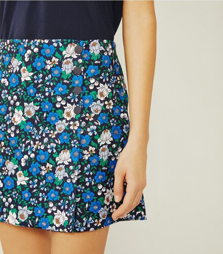Tory Sport designer bottoms Printed Tech Twill Golf Skort in Tory Navy/Frost Primary Floral on model detail