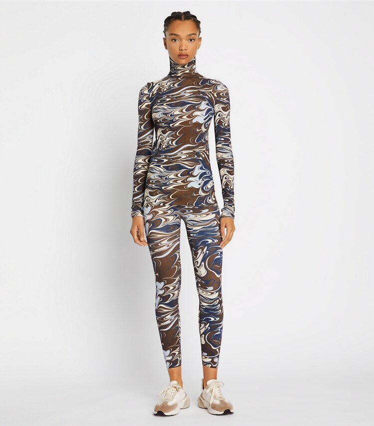 Tory Sport designer tops Printed Tissue-Seamless Mockneck in Dark Roast Marble Splash on model front